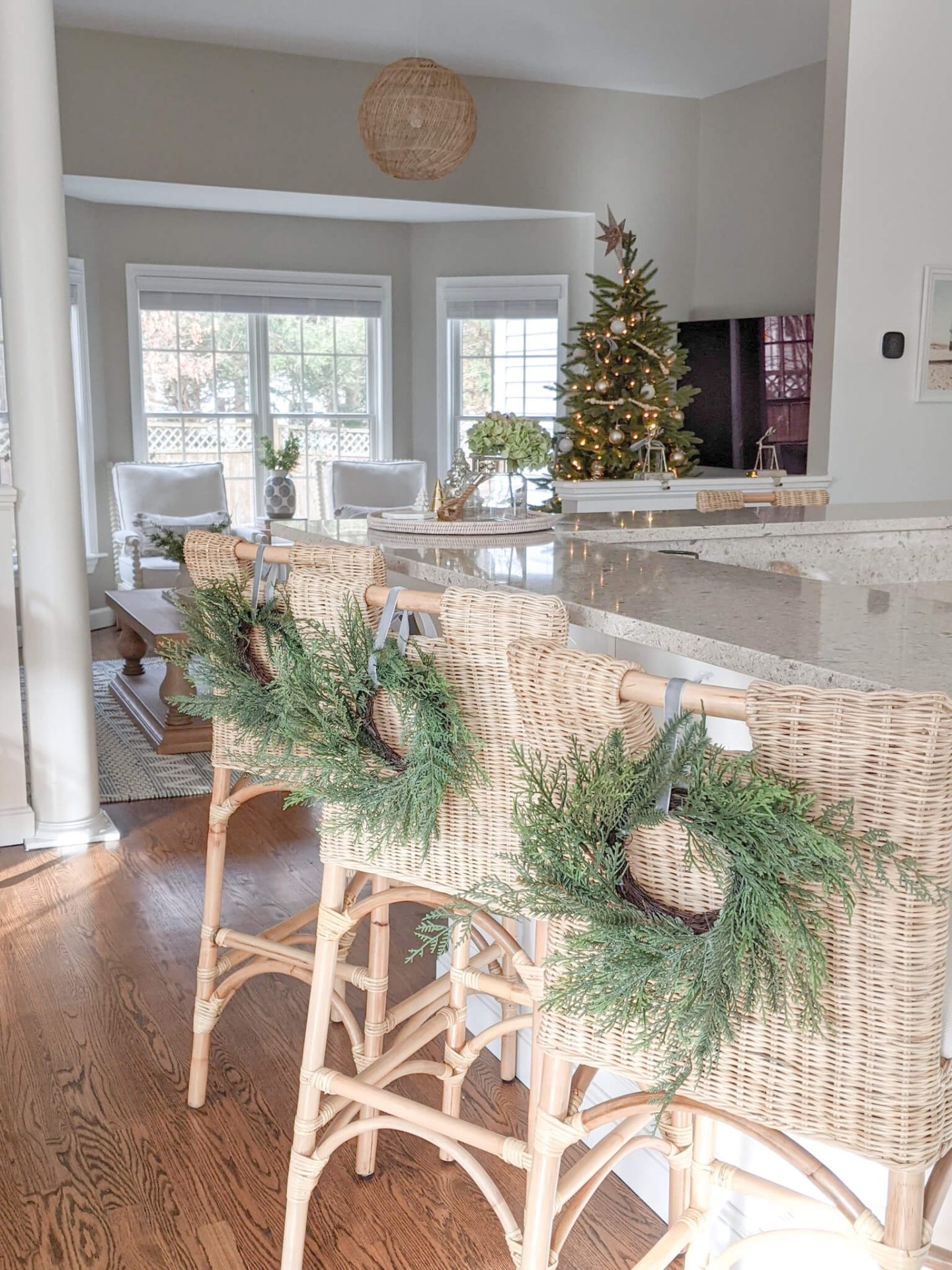 christmas wreaths on the backs of woven stools