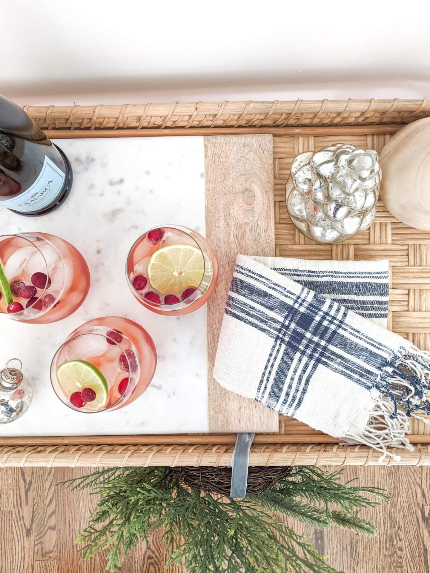 christmas cocktails on woven bar cart