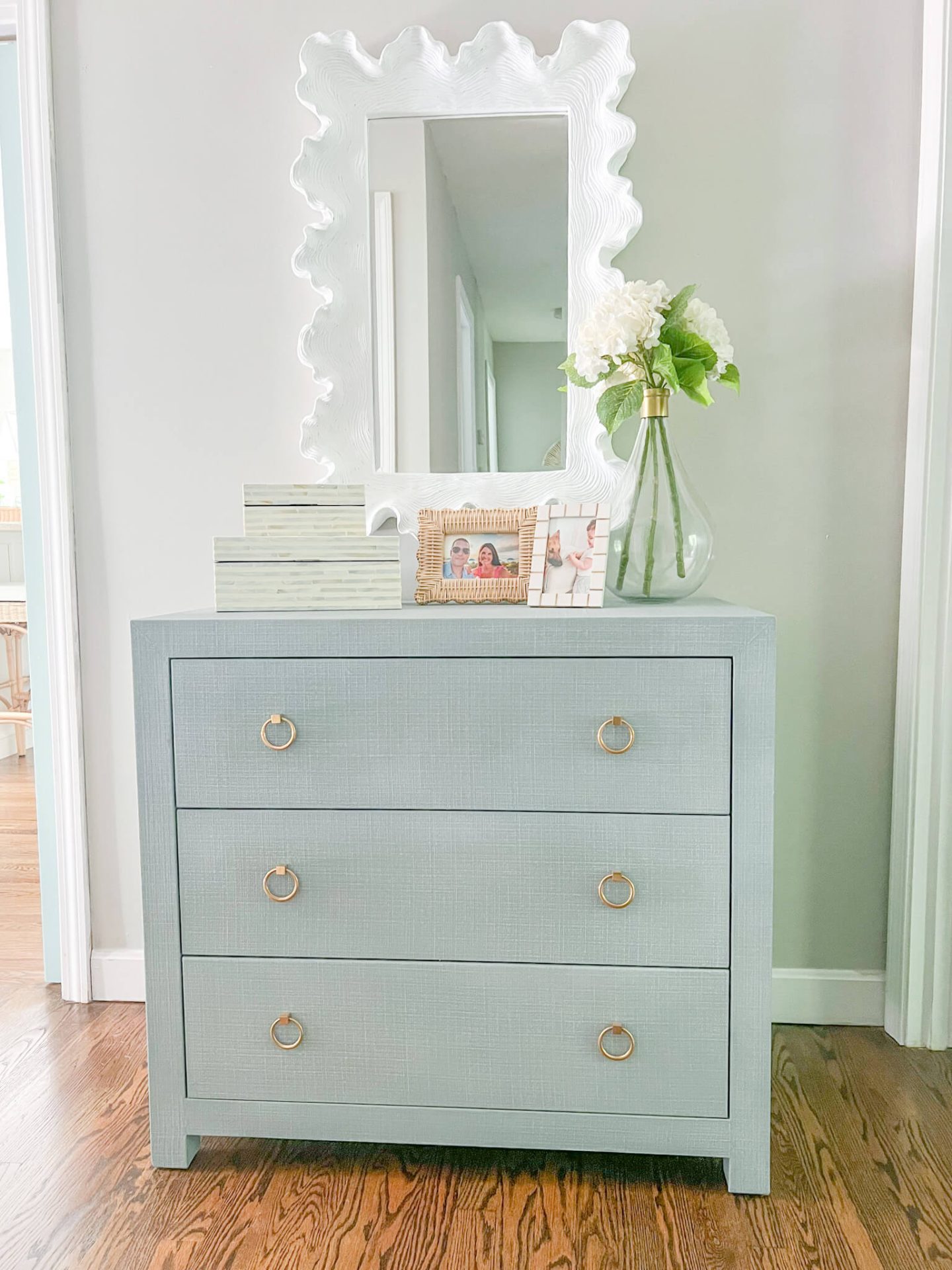 coastal blue 3 drawer chest with white mirror above it