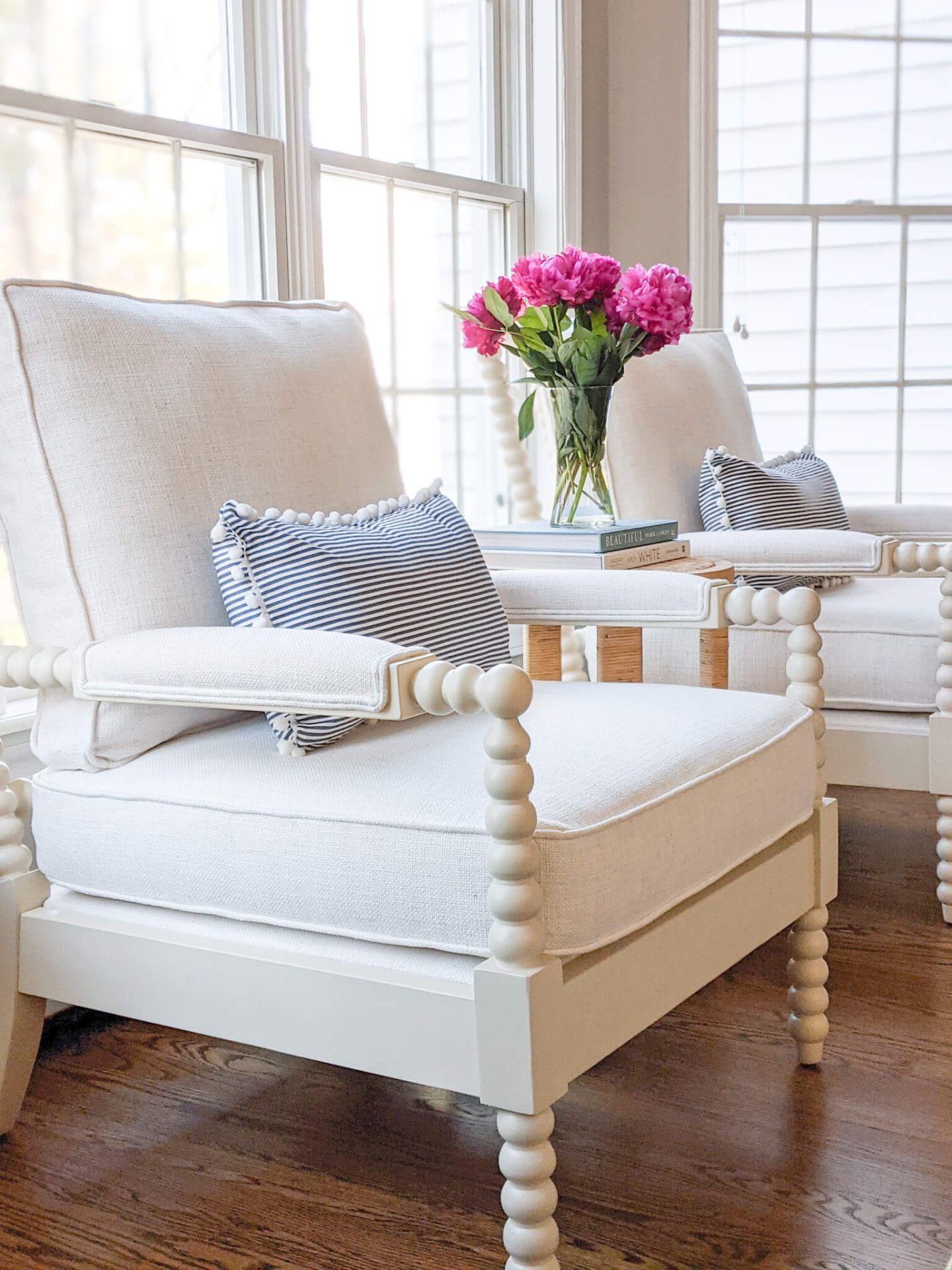 close up of white spindle arm chairs