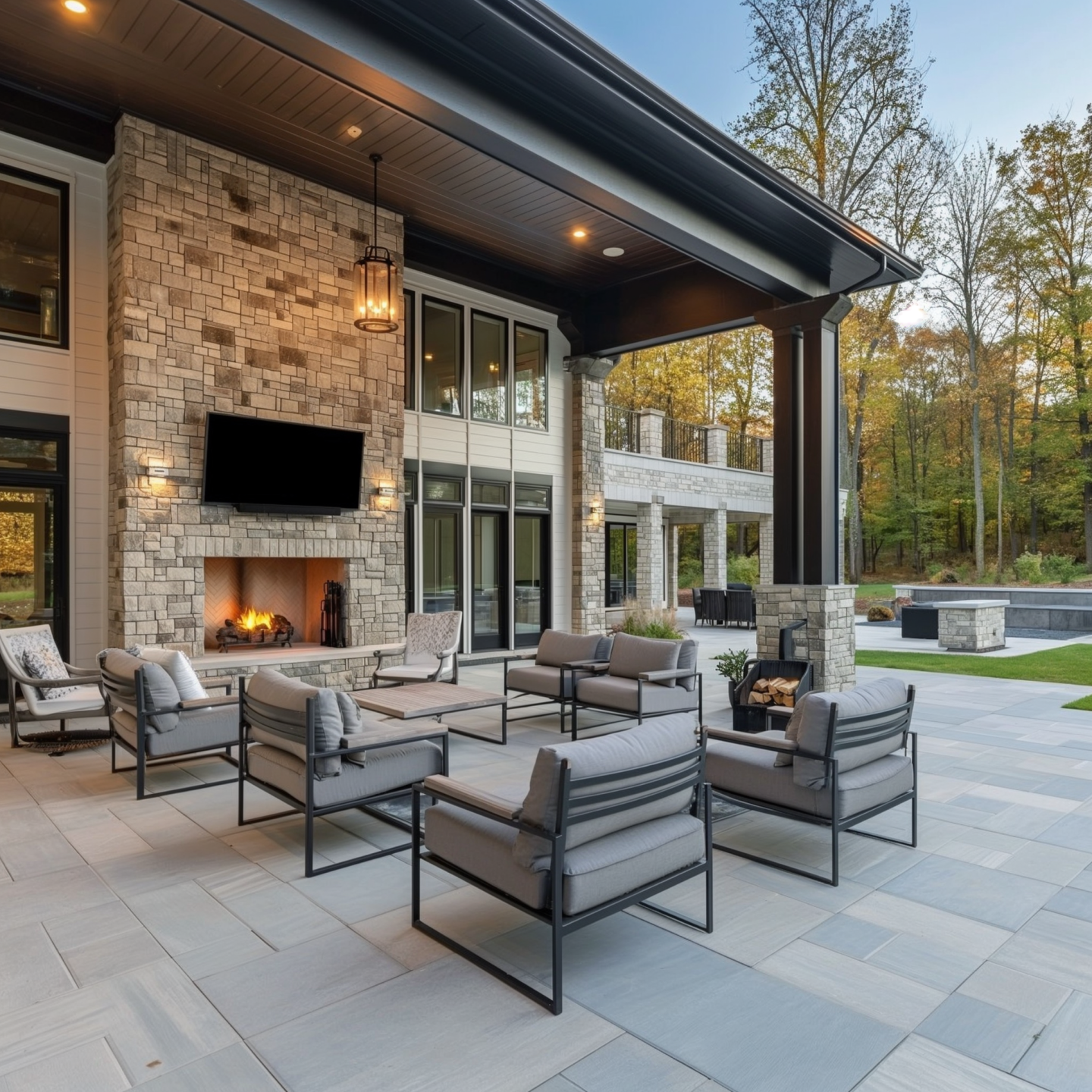 outdoor seating area with stone fireplace