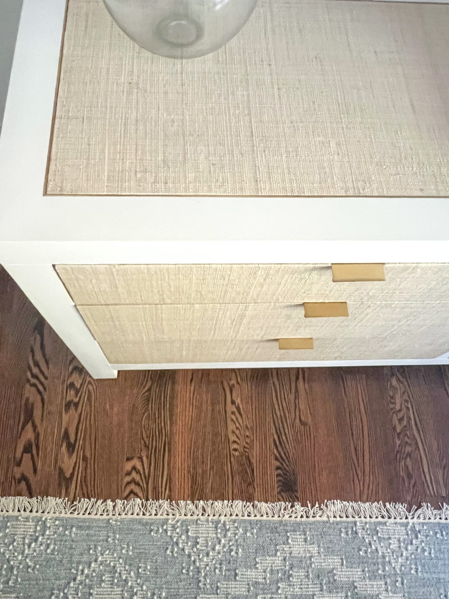 top of white coastal dresser with woven front